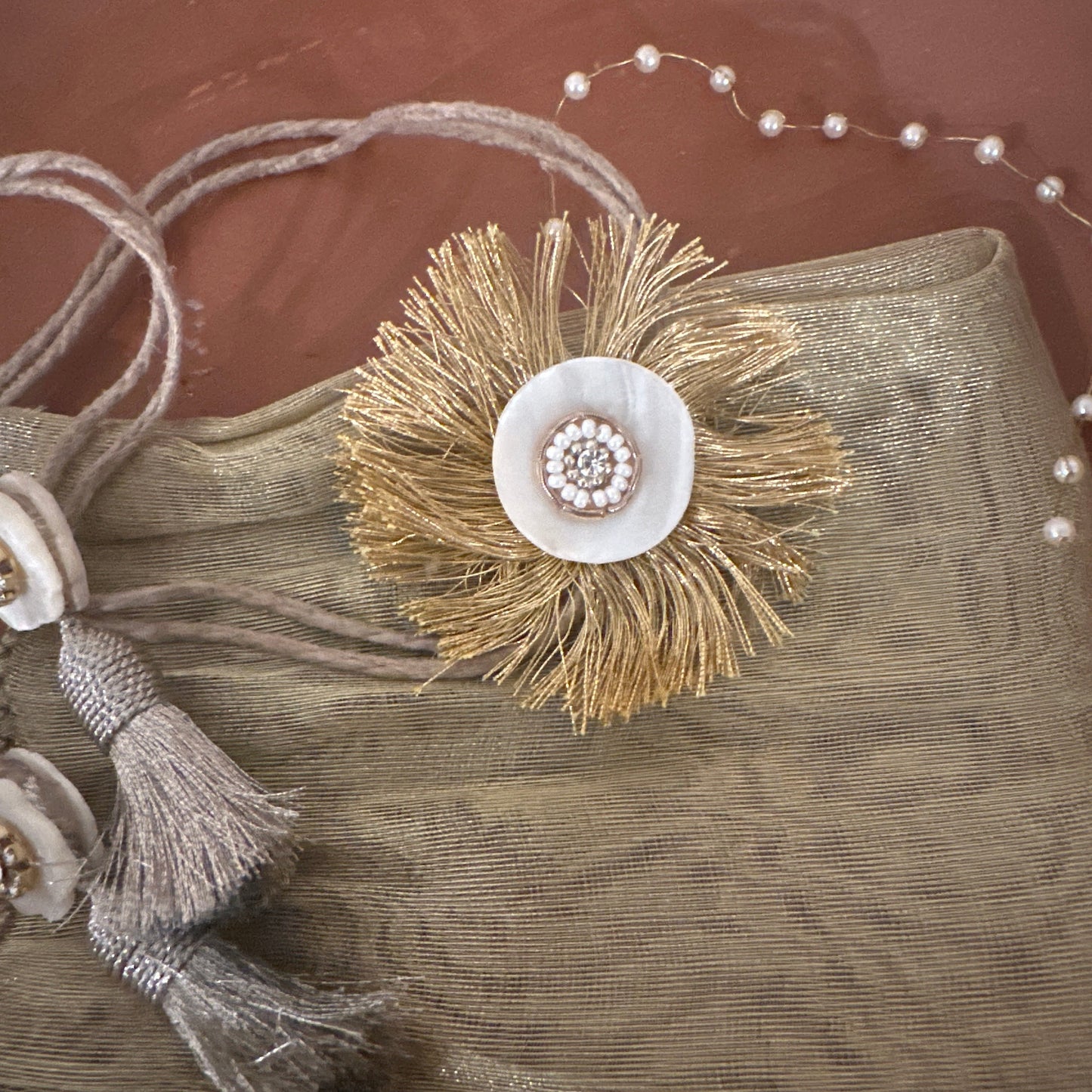 Golden Tissue and Shell Work Rakhi - Single