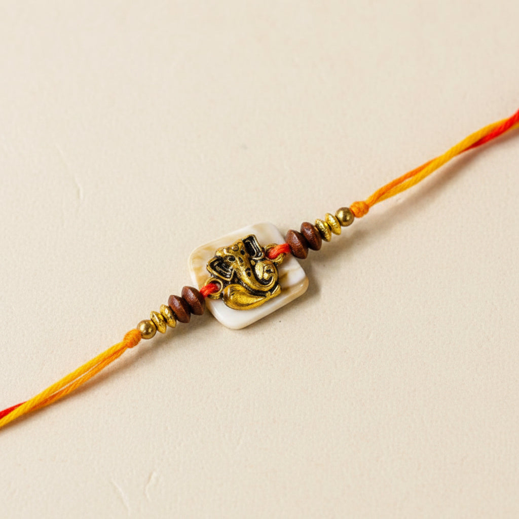 Golden Ganeshji On Off White Beads Rakhi - Single