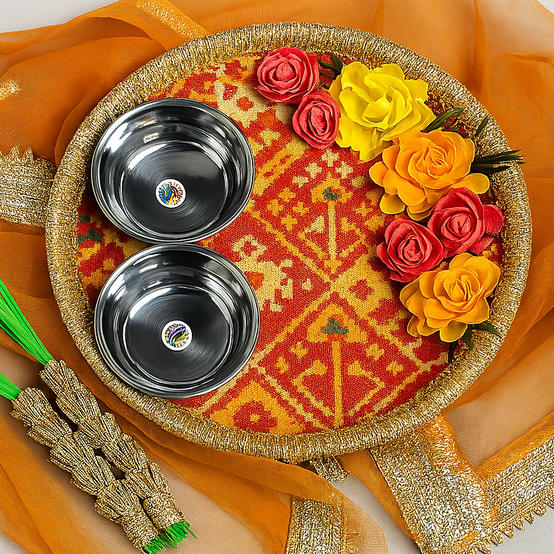 a decorative tray with three bowls and three flowers on it