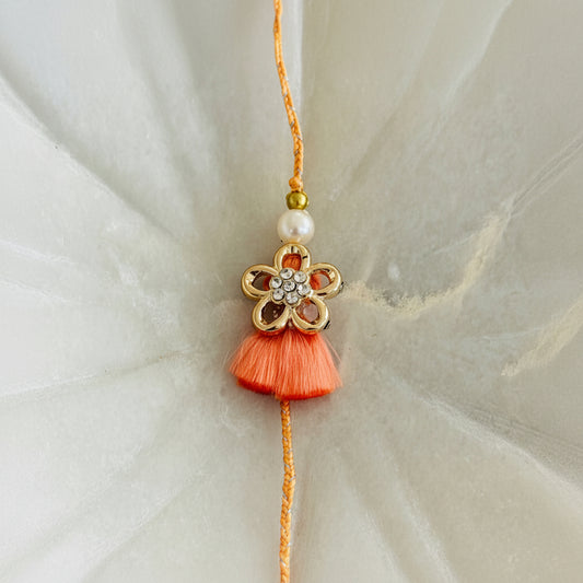 Golden Flower with Tassel Rakhi (Peach) - Single