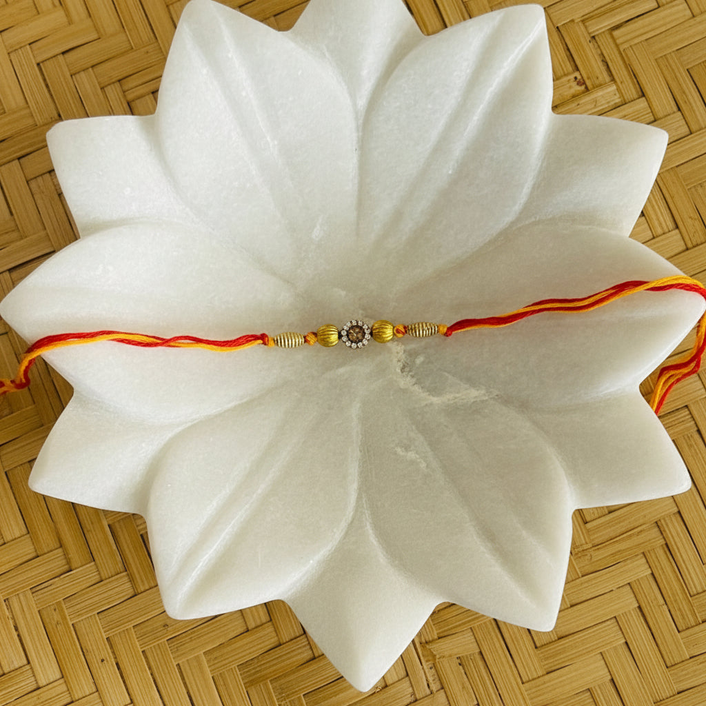 Very Small Stone & Two Golden Beads Rakhi - Single