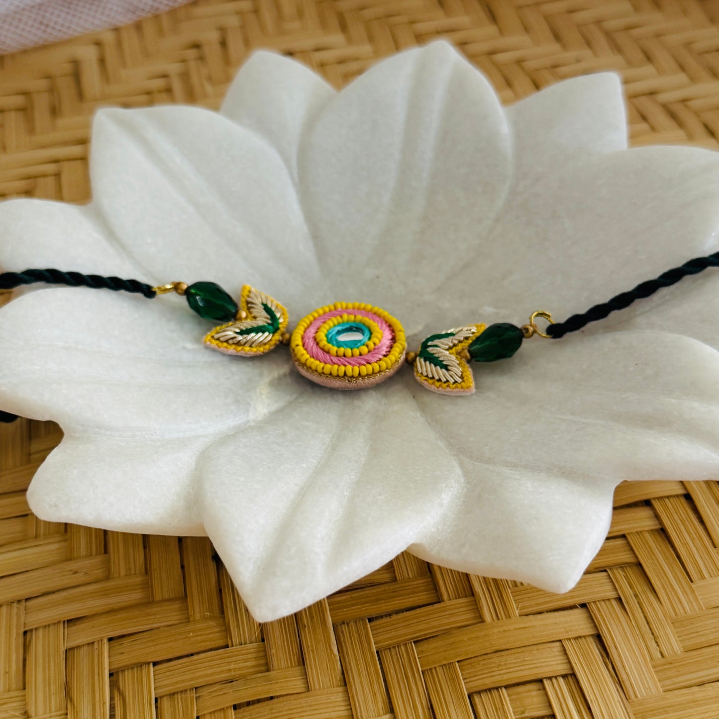 Handcrafted Circle Motif Rakhi – Green Thread with Leaf Accents
