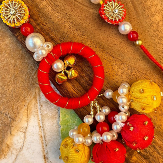 Orange And Yellow Bud and Pearl Bhaiya Bhabhi Rakhi Set