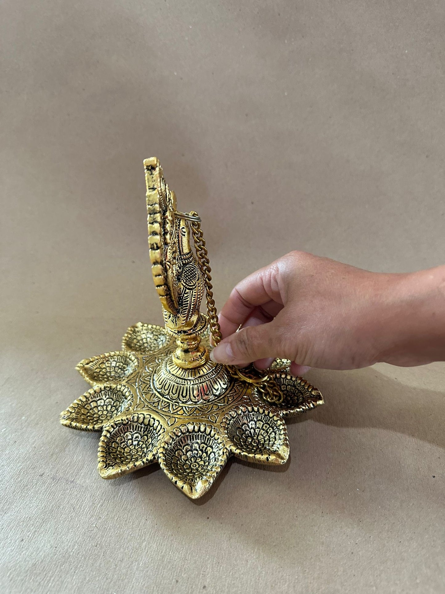 Red & Gold Potli – Packed with Metal Gold Oxide Mor Diya Hanging | Ready to Gift