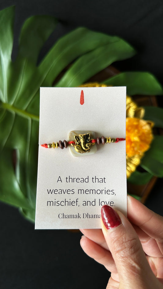 Golden Ganeshji On Off White Beads Rakhi - Single