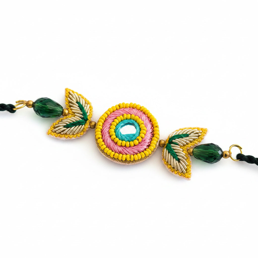 Handcrafted Circle Motif Rakhi – Green Thread with Leaf Accents