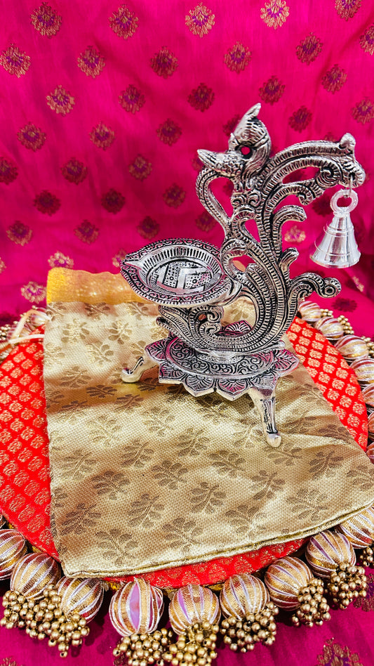 Brocade Potli with Peacock Diya Bell – Perfect Return Gift