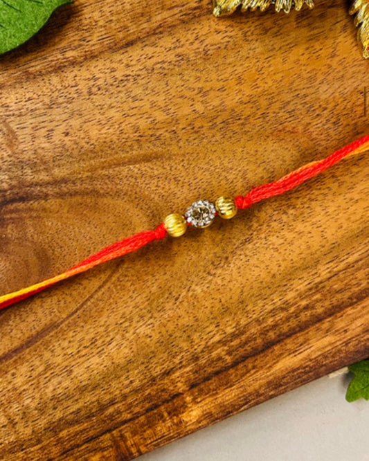 Very Small Stone & Two Golden Beads Rakhi - Single