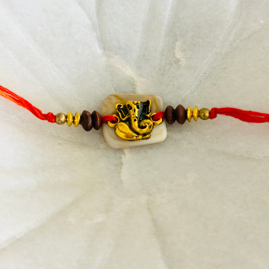 Golden Ganeshji On Off White Beads Rakhi - Single