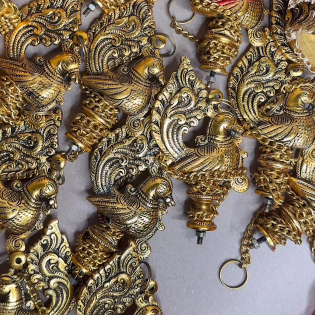 Red & Gold Potli – Packed with Metal Gold Oxide Mor Diya Hanging | Ready to Gift