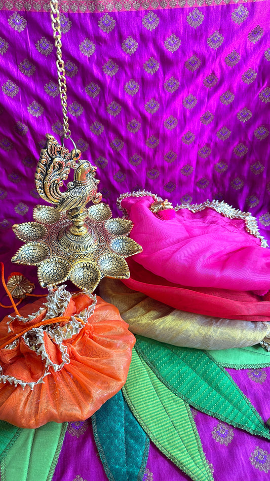 Gold Oxidized Peacock Diya Hanging with Organza Potli – Perfect for Diwali, Festival, & Wedding Gifts